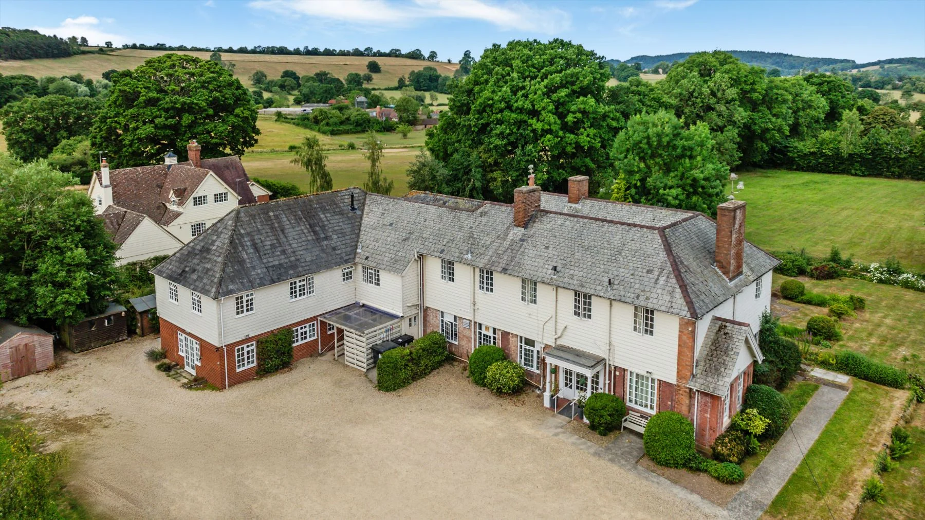 Aerial view of the front of the house and driveway
